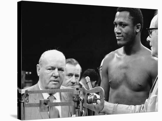 Joe Frazier at the Weigh in for His Fight Against Muhammad Ali-John Shearer-Stretched Canvas