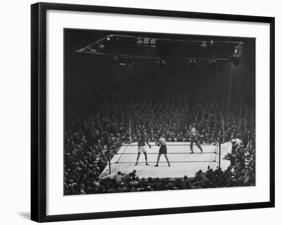 Joe Louis and Joe Walcott Boxing in Front of a Wide Eyed Crowd-Andreas Feininger-Framed Premium Photographic Print