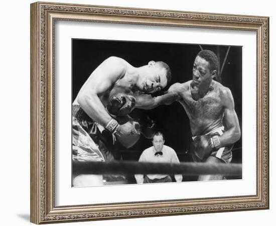 Joe Louis (Left), and Ezzard Charles, in a Heavyweight Title Bout, Sept. 27, 1950-null-Framed Photo