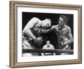 Joe Louis (Left), and Ezzard Charles, in a Heavyweight Title Bout, Sept. 27, 1950-null-Framed Photo