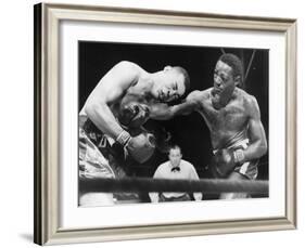 Joe Louis (Left), and Ezzard Charles, in a Heavyweight Title Bout, Sept. 27, 1950-null-Framed Photo