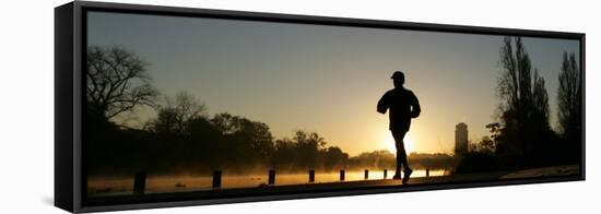 Jogger Silhouetted Against the Rising Sun as He Runs Past the Serpentine Lake in Hyde Park, London-null-Framed Stretched Canvas