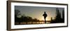 Jogger Silhouetted Against the Rising Sun as He Runs Past the Serpentine Lake in Hyde Park, London-null-Framed Premium Photographic Print