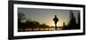 Jogger Silhouetted Against the Rising Sun as He Runs Past the Serpentine Lake in Hyde Park, London-null-Framed Photographic Print