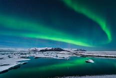 The Northern Lights Dance over the Glacier Lagoon in Iceland.-John A Davis-Laminated Photographic Print