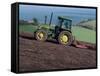 John Deere Tractor with a Rotivator on a Sloping Field in Spring, at Holcombe, Devon, England, UK-Ian Griffiths-Framed Stretched Canvas