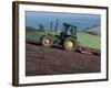 John Deere Tractor with a Rotivator on a Sloping Field in Spring, at Holcombe, Devon, England, UK-Ian Griffiths-Framed Photographic Print