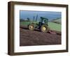 John Deere Tractor with a Rotivator on a Sloping Field in Spring, at Holcombe, Devon, England, UK-Ian Griffiths-Framed Photographic Print