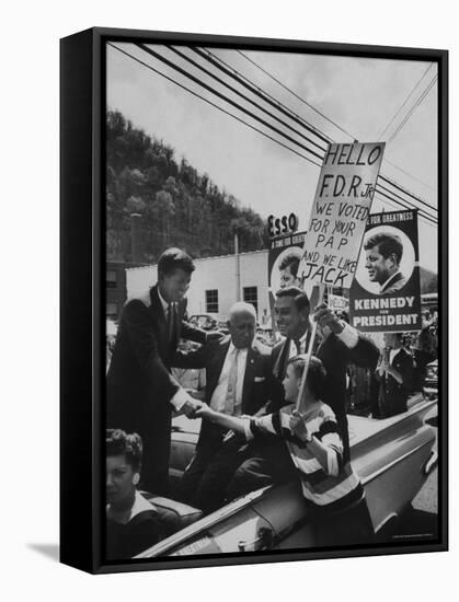 John F. Kennedy and Franklin D. Roosevelt Jr. Shaking Hands with Boy During Parade-Hank Walker-Framed Stretched Canvas