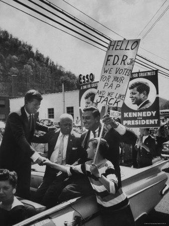 https://imgc.allpostersimages.com/img/posters/john-f-kennedy-and-franklin-d-roosevelt-jr-shaking-hands-with-boy-during-parade_u-L-P3NOAG0.jpg?artPerspective=n