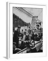 John F. Kennedy and Franklin D. Roosevelt Jr. Shaking Hands with Boy During Parade-Hank Walker-Framed Photographic Print