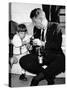 John F Kennedy Jr Looks at Cameras of White House Photographer Capt Cecil Stoughton, Nov 11, 1963-null-Stretched Canvas