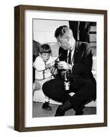 John F Kennedy Jr Looks at Cameras of White House Photographer Capt Cecil Stoughton, Nov 11, 1963-null-Framed Photo