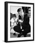 John F Kennedy Jr Looks at Cameras of White House Photographer Capt Cecil Stoughton, Nov 11, 1963-null-Framed Photo