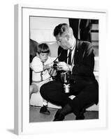 John F Kennedy Jr Looks at Cameras of White House Photographer Capt Cecil Stoughton, Nov 11, 1963-null-Framed Photo