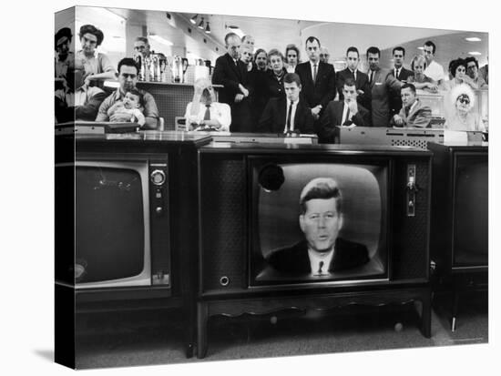 John F. Kennedy's TV Announcement of Cuban Blockade During the Missile Crisis in a Department Store-Ralph Crane-Stretched Canvas