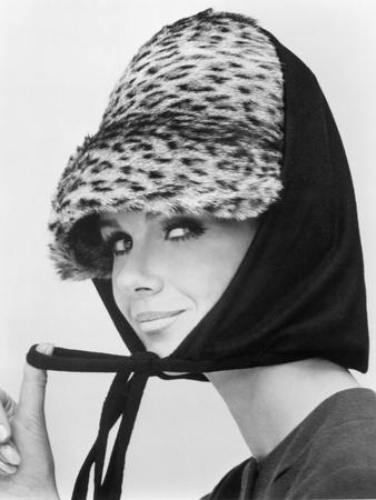 Nicole de la Marge in an Otto Lucas Jersey Scarf over an Ocelot Hat, 1964