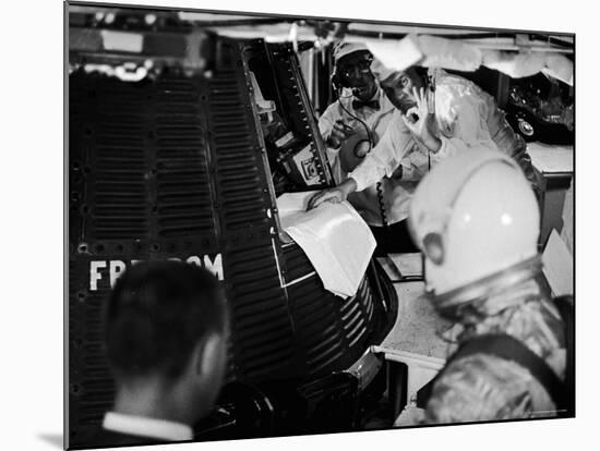 John Glenn Checking Out Mercury Capsule That Will Launch Alan Shepard into Space-Ralph Morse-Mounted Premium Photographic Print