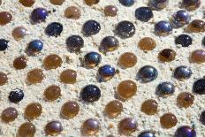 Close up of glass marbles in sand-John Gollings-Photo