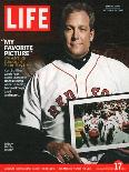 Red Sox Pitcher, Curt Schilling, Holding Photo of 2004 World Series Victory, December 17, 2004-John Huet-Mounted Photographic Print