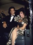 Actors Michael Nader and Joan Collins Sitting in a Car-John Paschal-Premium Photographic Print