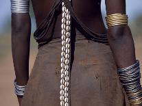 Young Dassanech Girl Wears a Leather Skirt, Metal Bracelets, Amulets and Bead Necklaces, Ethiopia-John Warburton-lee-Photographic Print