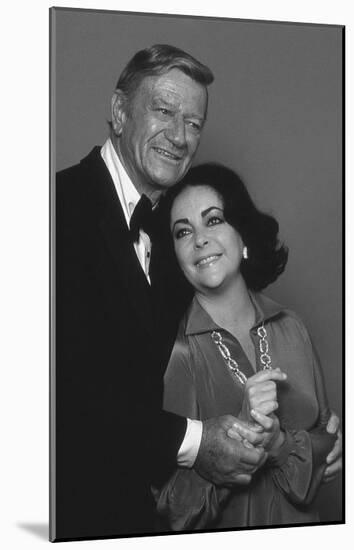 John Wayne and Elizabeth Taylor-null-Mounted Art Print