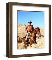 John Wayne on horse in mountains-Movie Star News-Framed Photo