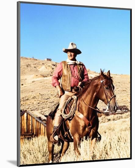 John Wayne on horse in mountains-Movie Star News-Mounted Photo