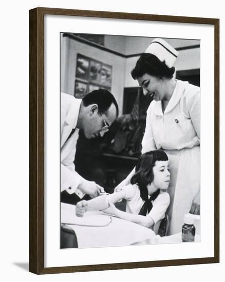 Jonas E. Salk Inoculating Child with Polio Vaccine He Developed, Ca. 1955-null-Framed Photo