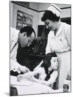 Jonas E. Salk Inoculating Child with Polio Vaccine He Developed, Ca. 1955-null-Mounted Photo