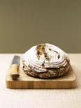 Bauernbrot (German Farm Bread) on Wooden Board with Knife-Jost Hiller-Photographic Print