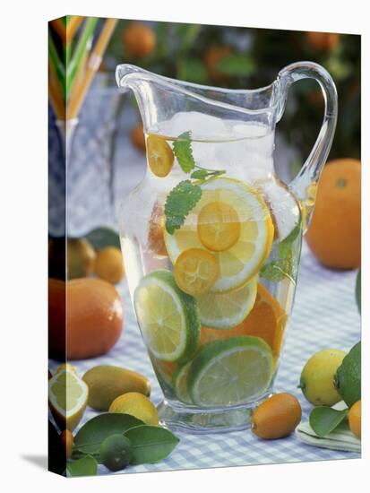 Jug of Water with Citrus Fruit, Lemon Balm and Ice Cubes-F. Strauss-Stretched Canvas