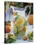 Jug of Water with Citrus Fruit, Lemon Balm and Ice Cubes-F. Strauss-Stretched Canvas