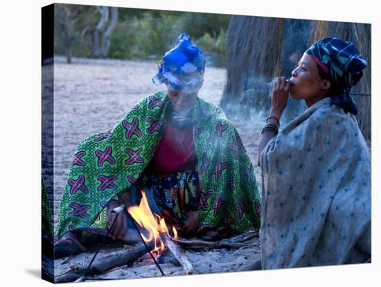 Jul'Hoan !Kung Bushman, Two Women Smoke around Fire in Village, Bushmanland, Namibia-Kim Walker-Stretched Canvas