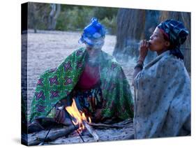 Jul'Hoan !Kung Bushman, Two Women Smoke around Fire in Village, Bushmanland, Namibia-Kim Walker-Stretched Canvas