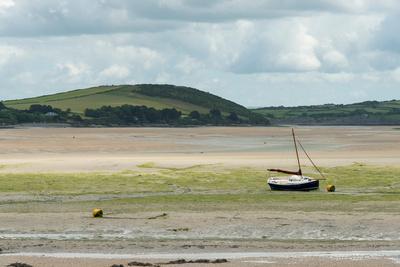 A Boat Moored at Low Tide in the River Camel Estuary at Padstow Cornwall UK