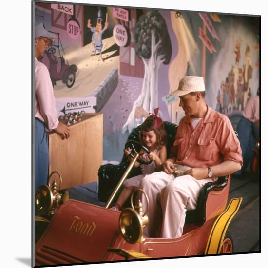 July 17 1955: Guests in the Mr Toad Wild Ride, Disneyland, Anaheim, California-Loomis Dean-Mounted Photographic Print