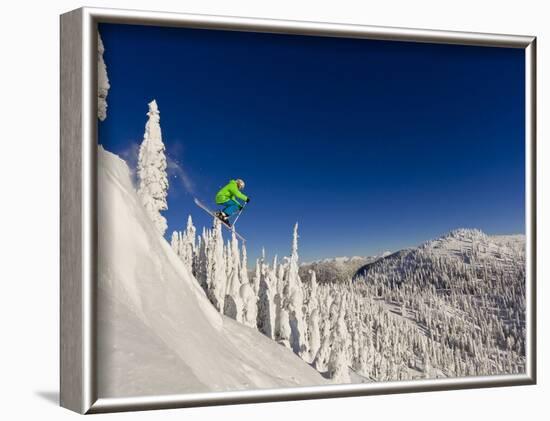 Jumping from Cliff on a Sunny Day at Whitefish Mountain Resort, Montana, Usa-Chuck Haney-Framed Photographic Print