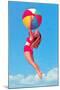 Jumping Woman with Beach Ball-null-Mounted Art Print