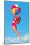 Jumping Woman with Beach Ball-null-Mounted Art Print