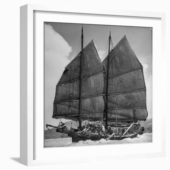 Junk Leaving Harbor with Patchwork Sails Up-Jack Birns-Framed Photographic Print