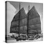Junk Leaving Harbor with Patchwork Sails Up-Jack Birns-Stretched Canvas