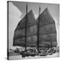 Junk Leaving Harbor with Patchwork Sails Up-Jack Birns-Stretched Canvas