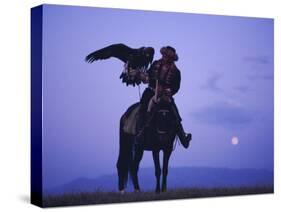 Kalanash Sarsembek with Eagle, a Hunter's Moonrise Over Steppe, Kazakhstan, Central Asia-David Beatty-Stretched Canvas