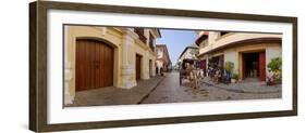 Kalesa moving along Calle Crisologo, Vigan, Ilocos Sur, Philippines-null-Framed Photographic Print