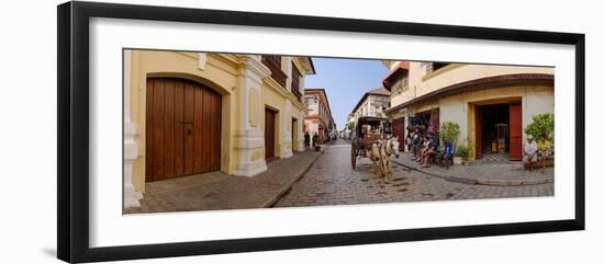 Kalesa moving along Calle Crisologo, Vigan, Ilocos Sur, Philippines-null-Framed Photographic Print