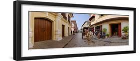 Kalesa moving along Calle Crisologo, Vigan, Ilocos Sur, Philippines-null-Framed Photographic Print