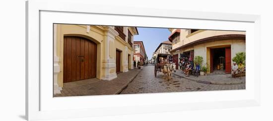 Kalesa moving along Calle Crisologo, Vigan, Ilocos Sur, Philippines-null-Framed Photographic Print