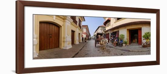 Kalesa moving along Calle Crisologo, Vigan, Ilocos Sur, Philippines-null-Framed Photographic Print